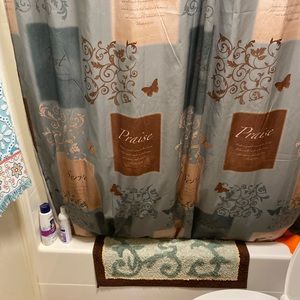 Matching shower curtain, bath mat and rug